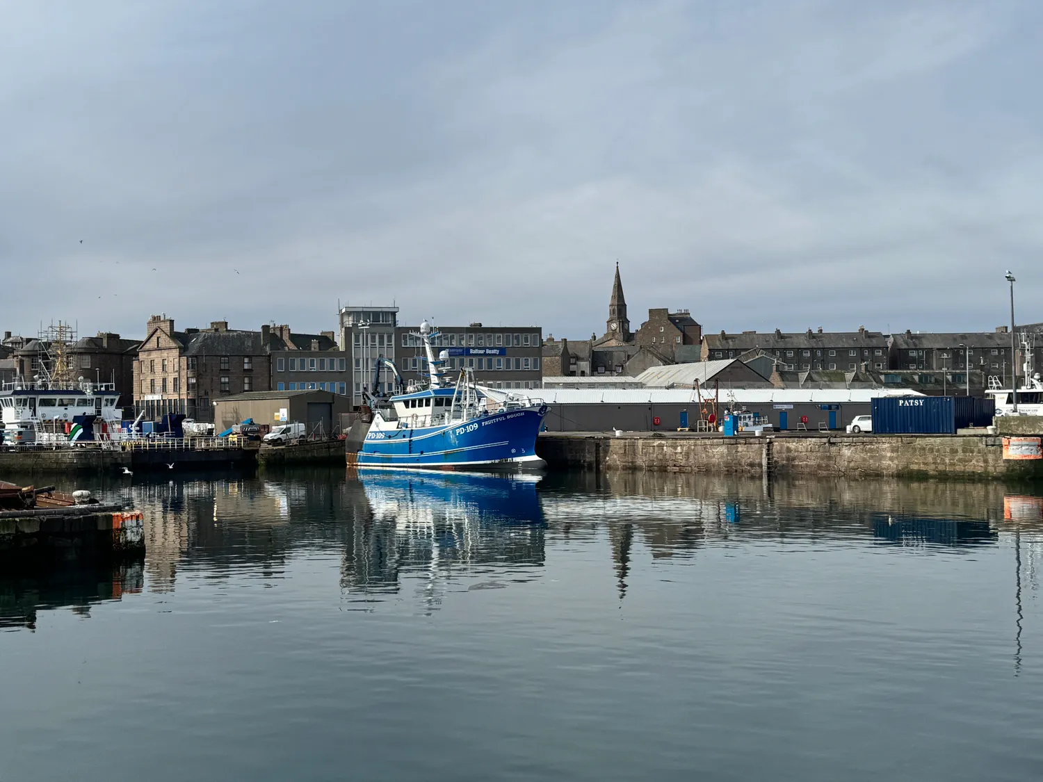 A blue trawler in the harbour at Peterhead